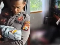 LAHIR. Polisi mengamankan bayi yang baru saja dilahirkan saat ibunya mudik dalam perjalanan dari Palopo ke Sulawesi Tengah.